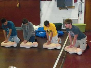 Health class practicing CPR skills